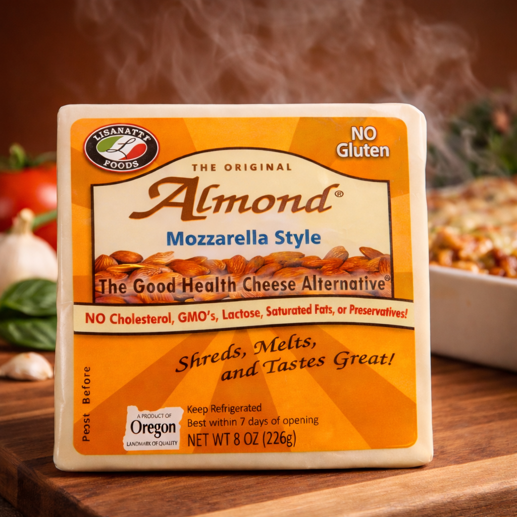 Almond cheese alternative package on a wooden surface with a warm casserole in background.